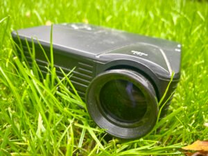 Projector in garden ready for a garden cinema night, sitting in grass